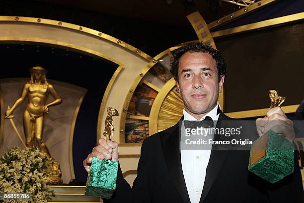 Italian director Matteo Garrone shows his award for Best Movie and Best Director with 'Gomorra' during the Italian Movie Awards ''David Di...