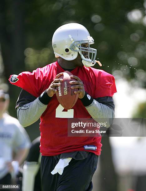 JaMarcus Russell of the Oakland Raiders drops back to pass the ball during the Raiders minicamp at the team's permanent training facility on May 8,...