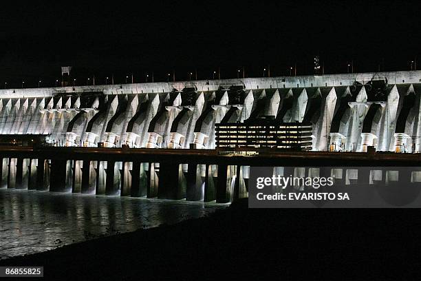 Night view of Itaipu hydroelectric dam on the Parana River at the border between Brazil and Paraguay, in Foz do Iguaçu, 1700 km south from Brasilia,...