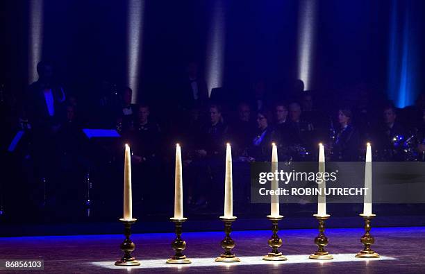 Six candles symbolize the six victims at a special memorial mass for the victims of the attack on Queensday in the Orpheus theatre in Apeldoorn on...