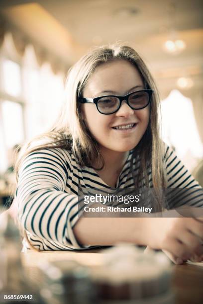 Portrait of a teenager with Down syndrome.