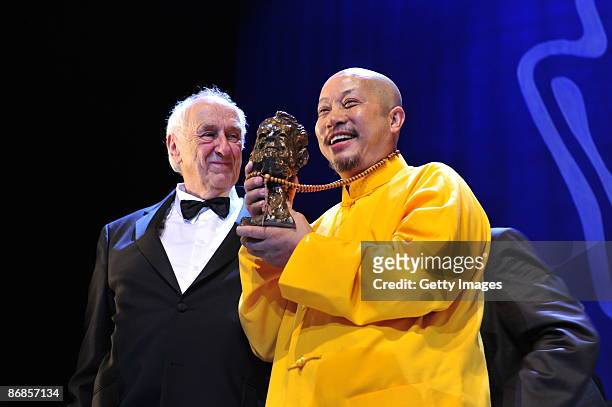 Photographer Thomas Hoepker and Yan Yankang, category best photography, attends the Henri-Nannen-Award at the Schauspielhaus on May 8, 2009 in...