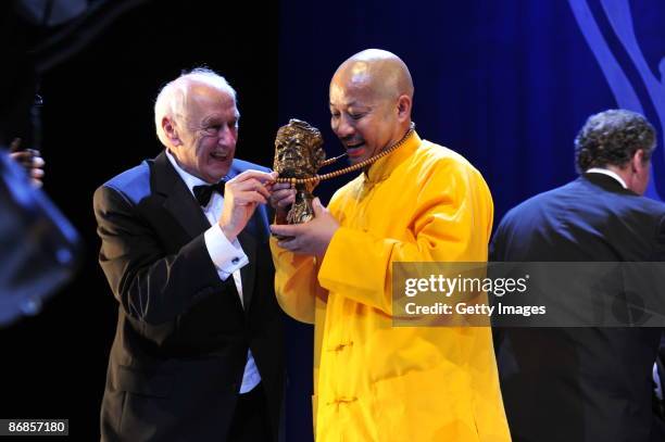 Photographer Thomas Hoepker and Yan Yankang, category best photography, attends the Henri-Nannen-Award at the Schauspielhaus on May 8, 2009 in...