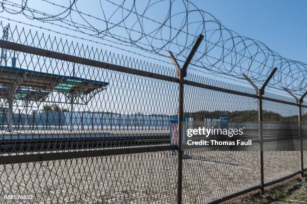 dorasan train station barbed wire fence between south and north korea - south korea dmz stock pictures, royalty-free photos & images
