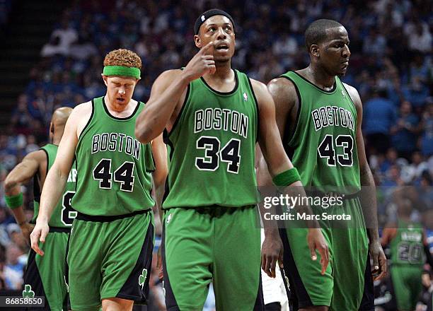 Paul Pierce, Brian Scalabrine#44 and Kendrick Perkins of the Boston Celtics walk onto the court against the Orlando Magic in Game Three of the...