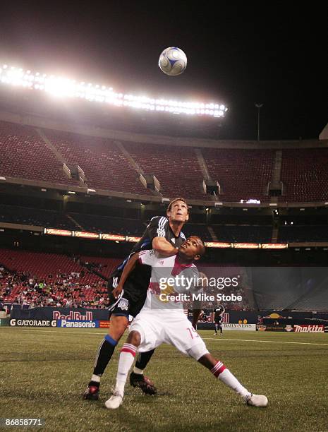 Dane Richards of the New York Red Bulls battles for the ball against Cam Weaver of the San Jose Earthquakes at Giants Stadium in the Meadowlands on...