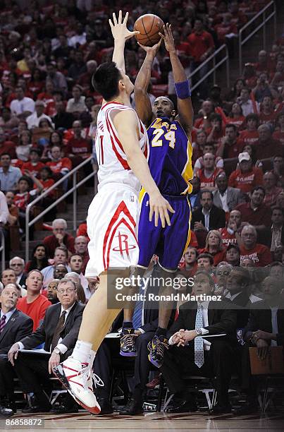 Guard Kobe Bryant of the Los Angeles Lakers takes a shot against Yao Ming of the Houston Rockets in Game Three of the Western Conference Semifinals...