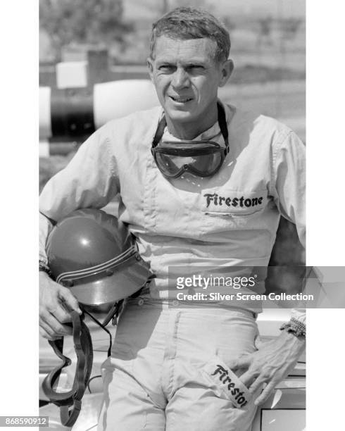 View of American actor Steve McQueen , in Firestone racing suit, at Riverside Raceway, Riverside, California, July 1966.