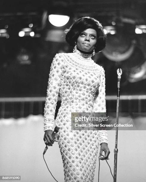 Low-angle view of American Pop and Rhythm & Blues singer Diana Ross, of the Supremes, as she performs on an unspecified television show, late 1960s.