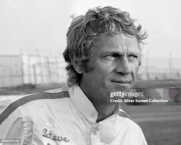 Close-up of American actor Steve McQueen , in a personalized racing suit, as he promotes the film 'Le Mans' , France, 1971.