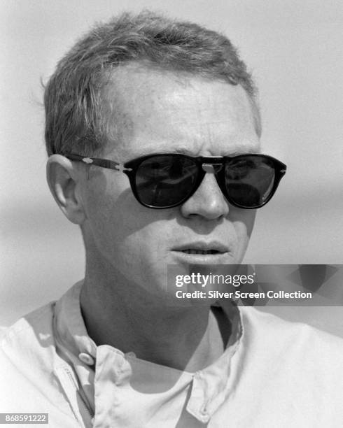 View of American actor Steve McQueen , in sunglasses, at Riverside Raceway, Riverside, California, July 1966.
