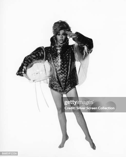 Portrait of American actress Jane Fonda as she poses against a white background for 'Barbarella' , Rome, Italy, 1968.