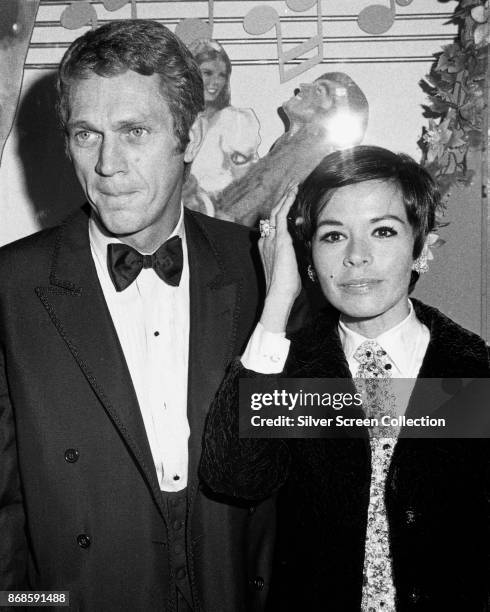 Portrait of married actors Steve McQueen and Neile Adams as they attend the premiere of the 'Doctor Dolittle' at the Paramount Theater, Los Angeles,...