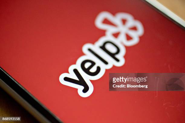 The Yelp Inc. Application is displayed on for a photograph an Apple Inc. IPhone in Washington, D.C., U.S., on Saturday, Oct. 28, 2017. Yelp Inc. Is...