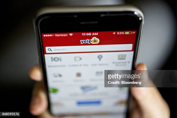 The Yelp Inc. Application is displayed on for a photograph an Apple Inc. IPhone in Washington, D.C., U.S., on Saturday, Oct. 28, 2017. Yelp Inc. Is...