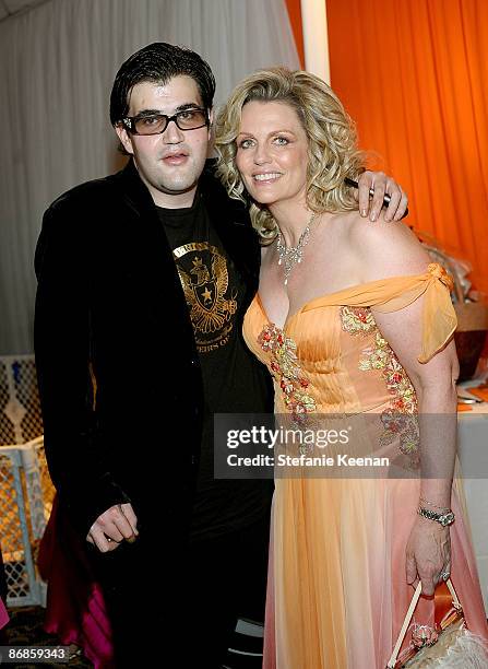 Co-chair Nancy Davis and son Jason Davis attend the 16th Annual Race To Erase MS cocktail reception co-chaired by Nancy Davis and Tommy Hilfiger at...