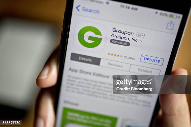 The Groupon Inc. Application is seen in the App Store on an Apple Inc. IPhone in this arranged photograph taken in Washington, D.C., U.S., on...