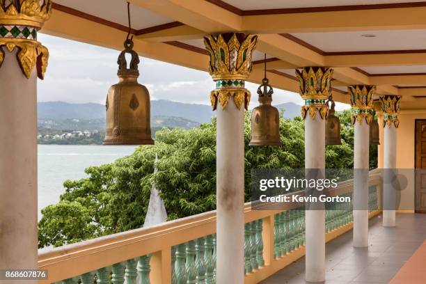 prayer bells in a buddhist temple - großer buddha stock-fotos und bilder