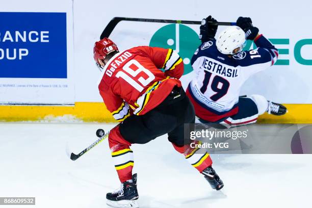 Brandon DeFazio of HC Kunlun Red Star vies for the puck during the 2017/18 KHL Regular Season ice hockey match between HC Kunlun Red Star and HC...