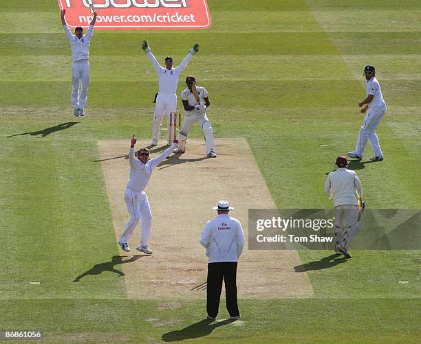 Graeme Swann of England celebrates the wicket of Jerome Taylor of West Indies during day three of the 1st npower Test match between England and West...