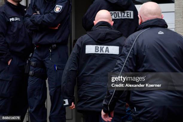 Police officers of the Federal Criminal Police Office, the Bundeskriminalamt, enter an apartment which was raided earlier by member of the GSG9...