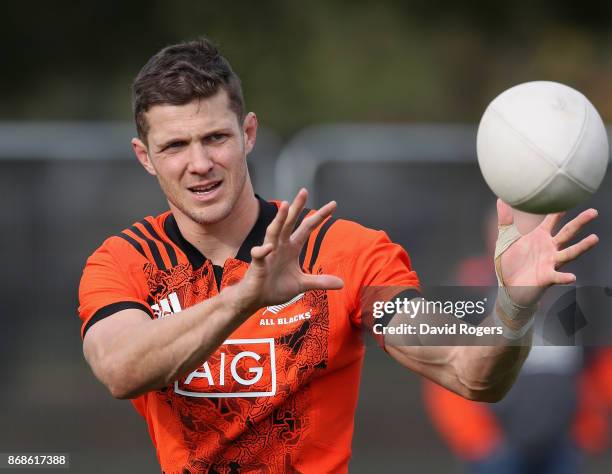 Matt Duffie catches the ball during the New Zealand All Blacks training session held at the Lensbury on October 31, 2017 in London, England.