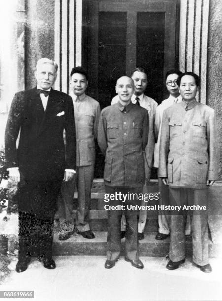 President Chiang Kai-shek, center, and Mao Zedong, right, with US Ambassador to China, Patrick J. Hurley in Chongqing, China.