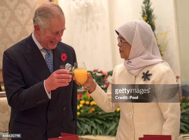 Prince Charles, Prince of Wales toasts with Singapore President, Halimah Yacob at a reception and dinner at the Istana Presidential Palace on October...