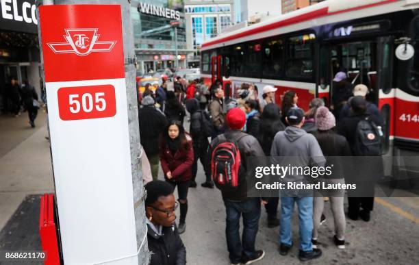 Crowds queue up to board the westbound 505 streetcar at Yonge and Dundas. Fifty TTC bus and streetcar routes exceed crowding standards at some point...