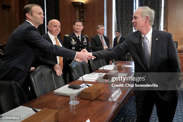 Senate Homeland Security and Governmental Affairs Committee Chairman Ron Johnson greets Federal Emergency Management Agency Administrator Brock Long,...