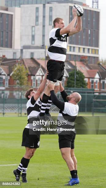 Dominic Bird of Barbarians jumps in a lineout during a training session at Latymer Upper School playing fields on October 31, 2017 in London, England.