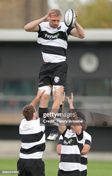 Dominic Bird of Barbarians jumps in a lineout during a training session at Latymer Upper School playing fields on October 31, 2017 in London, England.