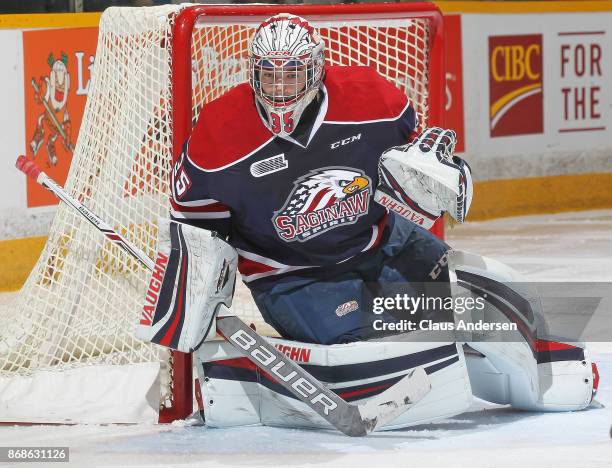 Evan Cormier of the Saginaw Spirit covers the corner against the Peterborough Petes in an OHL game at the Peterborough Memorial Centre on October 26,...