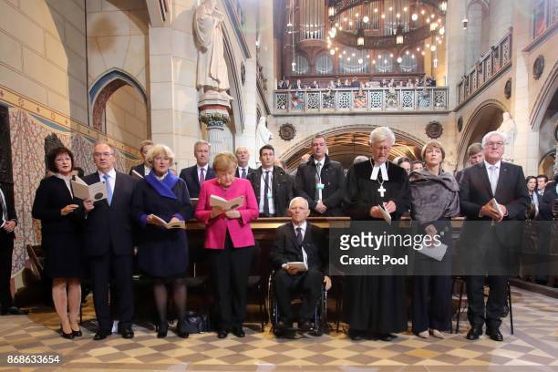 German President Frank-Walter Steinmeier, his wife Elke Buedenbender, the Chair of the Council of the Evangelical Church in Germany Heinrich...