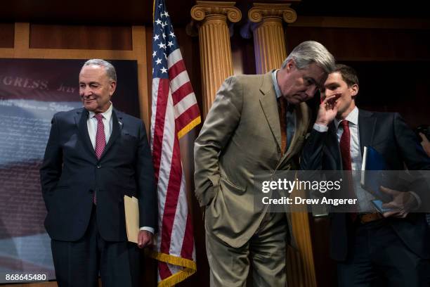 Senate Minority Leader Chuck Schumer and Sen. Sheldon Whitehouse attend a press conference to discuss their proposals for raising the 401 pre-tax...