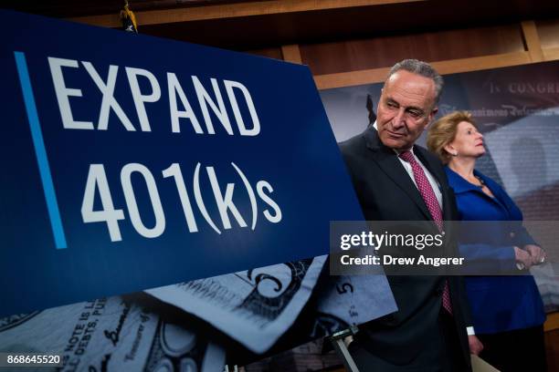 Senate Minority Leader Chuck Schumer and Sen. Debbie Stabenow attend a press conference to discuss their proposals for raising the 401 pre-tax...