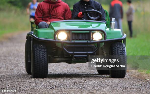 utility cart driving on the dirt path - off road buggy stock pictures, royalty-free photos & images