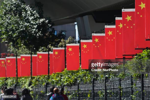 View of China National Flags seen in Shanghai city center, near the birthplace of China's Communist Party in Shanghai, where Mao Zedong and 12 other...