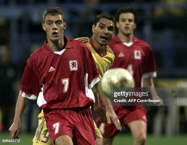 Schauls Manou from Luxembourg runs after the ball with Ganea Ionel from Romania in EURO2004 qualification match in Ploiesti , 06 September 2003. AFP...