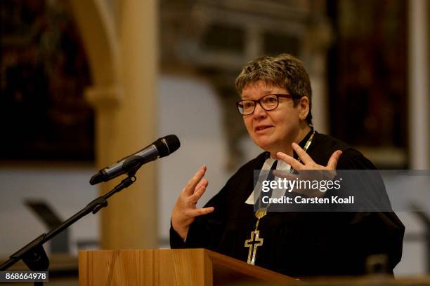 Protestant Bishop Ilse Junkermann preaches during a service in the Stadtkirche Sankt Marien church to commemorate the 500th anniversary of Luther's...