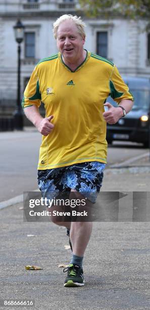 British Foreign Secretary Boris Johnson jogging in Westminster October 31, 2017 in London, England.