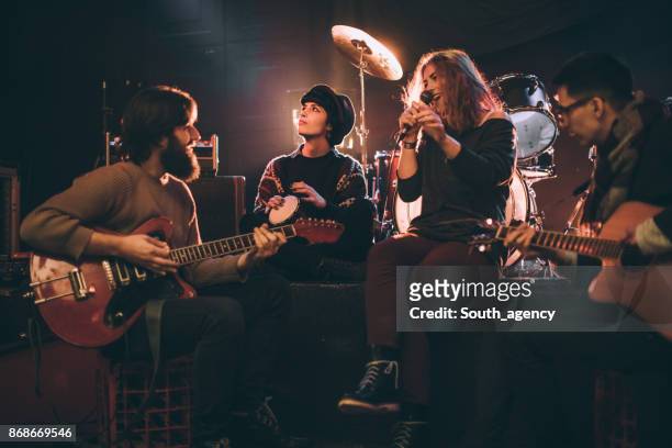 band playing in the club - performance group stock pictures, royalty-free photos & images