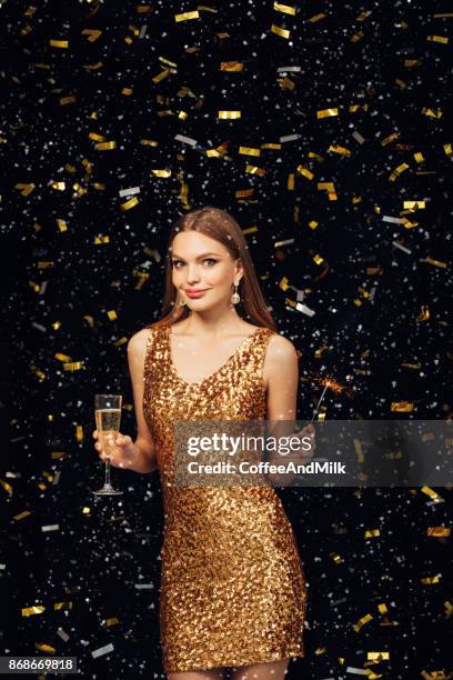 smiling girl with christmas sparkler - champagne flute milk stock pictures, royalty-free photos & images