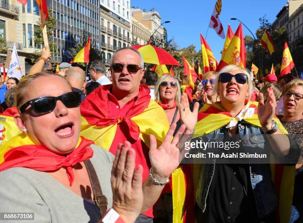 Protesters gather during a pro-unity demonstration on October 29, 2017 in Barcelona, Spain. Thousands of pro-unity protesters gather in Barcelona,...