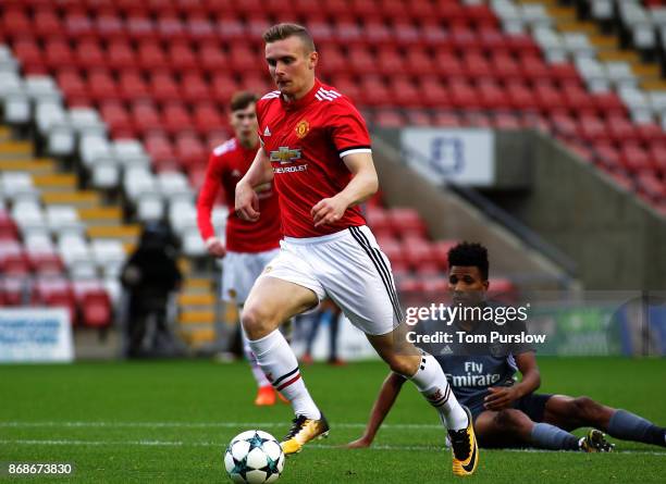 Ethan Hamilton of Manchester United scores their first goal during the UEFA Youth League match between Manchester United and SL Benfica at Leigh...