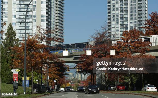 translink skytrain in surrey, british columbia, canada in autumn - vancouver skytrain stock pictures, royalty-free photos & images