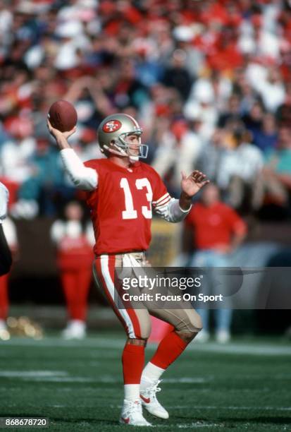 Steve Bono of the San Francisco 49ers looks to pass against the New Orleans Saints during an NFL football game December 1, 1991 at Candlestick Park...