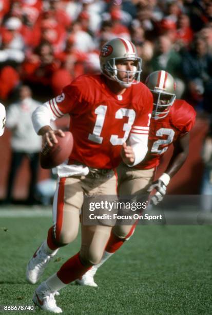 Steve Bono of the San Francisco 49ers runs with the ball against the New Orleans Saints during an NFL football game December 1, 1991 at Candlestick...