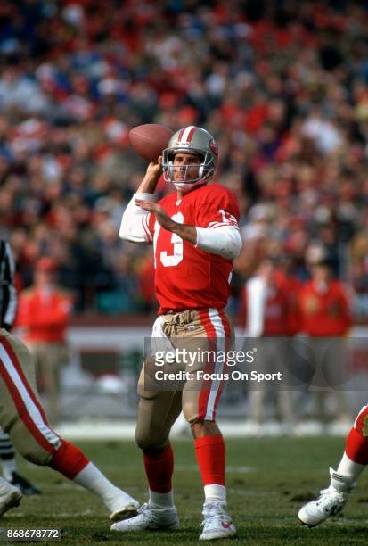 Steve Bono of the San Francisco 49ers drops back to pass against the New Orleans Saints during an NFL football game December 1, 1991 at Candlestick...