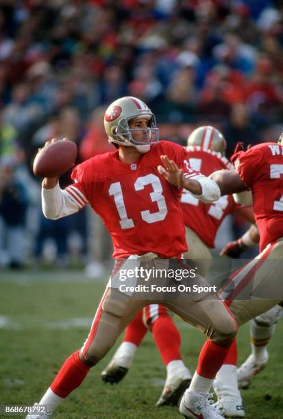 Steve Bono of the San Francisco 49ers drops back to pass against the Kansa City Chiefs during an NFL football game December 14, 1991 at Candlestick...